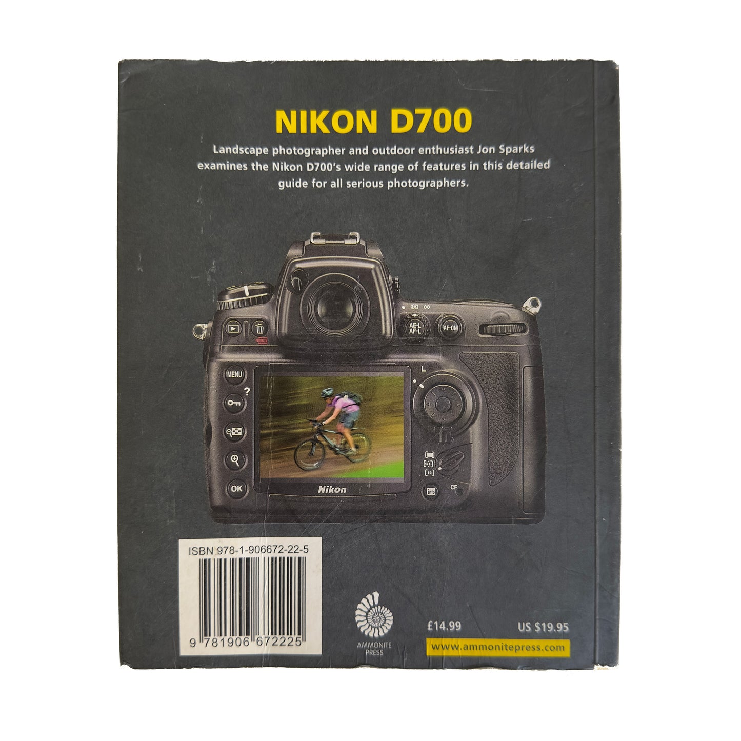 Book cover of 'Nikon D700' with a camera illustration and text on a black background