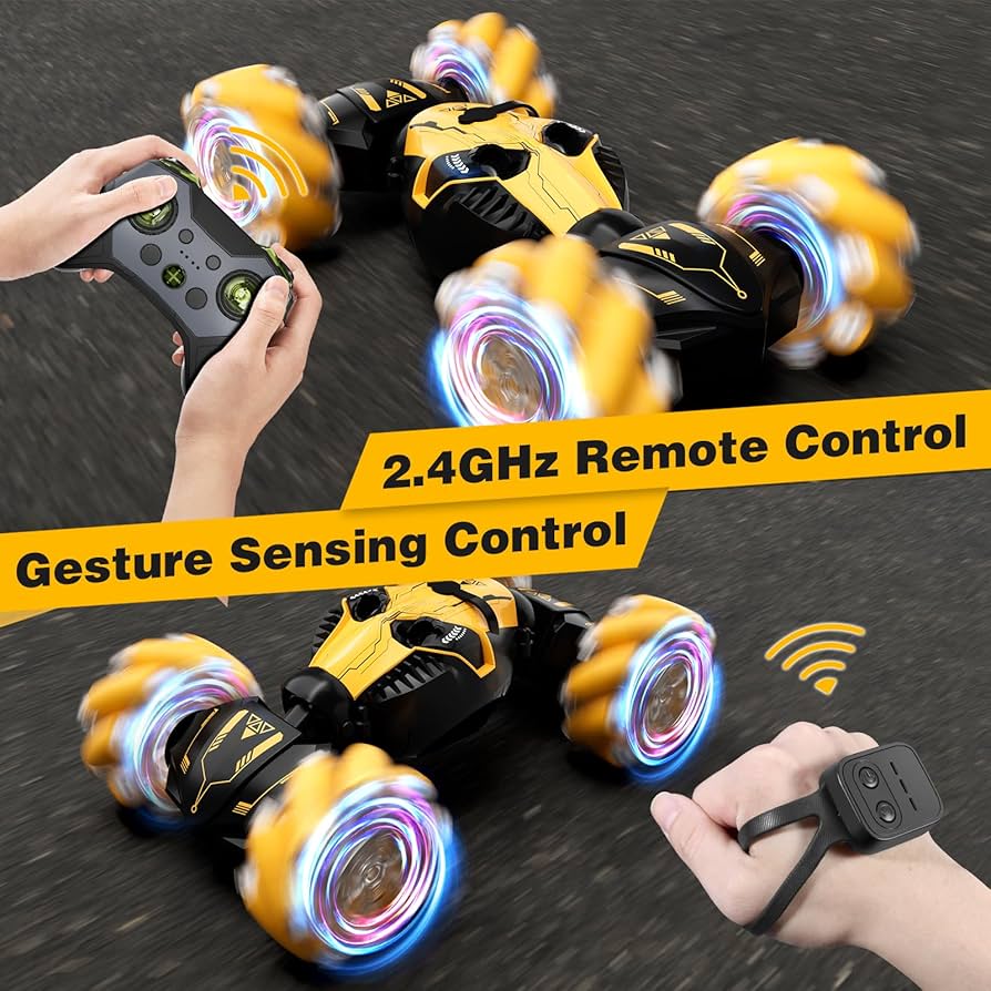 Toy car with colorful wheels controlled by a remote and gesture sensor on a dark surface.