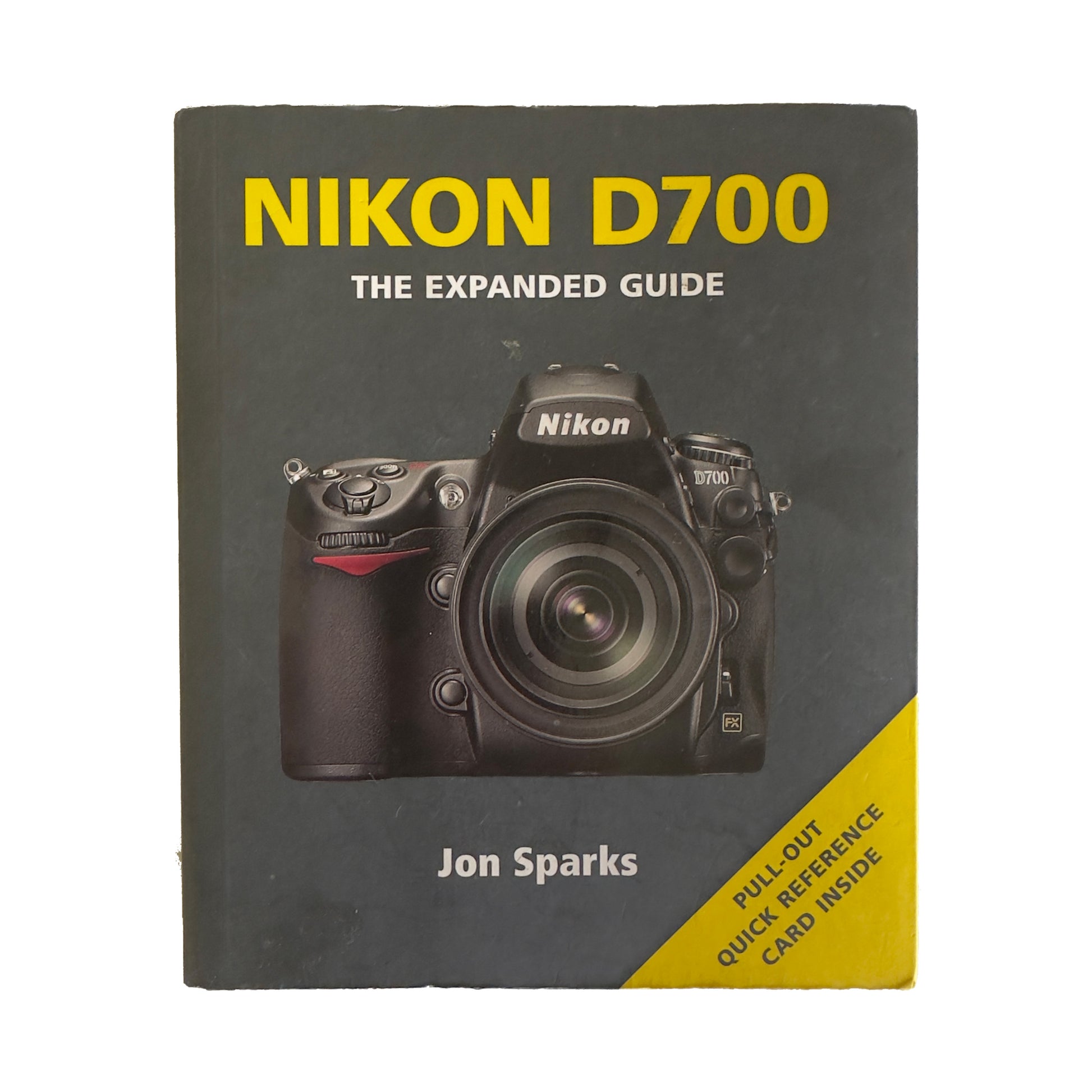 Book titled 'Nikon D700: The Expanded Guide' by Jon Sparks with a Nikon camera on the cover.